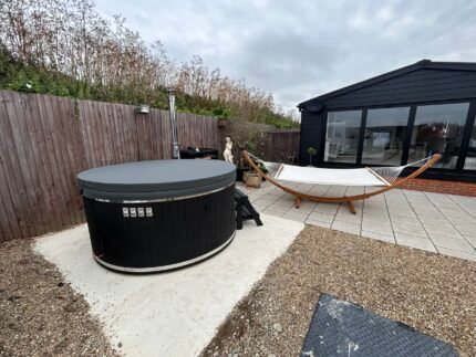 Brit Hot Tubs - Elevate Your Outdoor Oasis with the Luxurious SOLINA Acrylic Hot Tub Imagine transforming your backyard into a private sanctuary of relaxation and indulgence. Introducing the SOLINA Acrylic Hot Tub – a premium 6-8 seater that promises to elevate your outdoor living experience to new heights. Priced at £4,500 this exceptional hot tub combines unparalleled comfort, sophisticated style, and advanced features that will make every soak an unforgettable escape. Whether you're seeking a serene solo retreat or a social gathering space for family and friends, the SOLINA is designed to cater to your every need. SOLINA Acrylic Hot Tub - Spacious Splendor Step into a world of pure indulgence with the SOLINA's spacious interior. Boasting an impressive internal diameter of 204 cm and an external diameter of 225 cm, this hot tub comfortably accommodates up to 8 people. Sink into the generously sized bench seating, measuring 27 cm in height and 36 cm in width, and let the warm, soothing waters envelop you. Durable Elegance Crafted from high-quality acrylic, the SOLINA hot tub exudes a sleek, modern aesthetic that complements any outdoor setting. Choose from a variety of insert colors – Grey, Blue, White, or Gold – to seamlessly blend with your personal style. The durable acrylic construction ensures your investment remains pristine and easy to maintain for years to come. Powerful Heating, Therapeutic Bliss At the heart of the SOLINA lies an external integrated wood-burning oven, crafted from AISI 304 stainless steel with a 30kW output (optional AISI 316 available). This impressive heating system warms the water efficiently in just 2 to 2.5 hours, so you can start your relaxation journey without delay. But the SOLINA offers more than just rapid heating. Immerse yourself in the therapeutic benefits of its 10 hydro massage jets and 12 air bubble jets, providing soothing relief for aching muscles and a truly spa-like experience. Ambiance and Convenience Set the mood for your outdoor oasis with the SOLINA's 5 LED lights, bathing the water in a soft, ambient glow. Enhance your enjoyment further with thoughtful features like the stainless steel chimney, high-flow drain tap, and insulated thermo cover lid. Personalize your hot tub's aesthetic by choosing from a range of oven front colors – Stainless Steel, Grey, or Black – and wood cladding stain options – Light Grey, Dark Grey, Light Brown, Dark Brown, or Black. Create Your Oasis of Relaxation Whether you're seeking a tranquil haven for personal rejuvenation or a gathering place to host unforgettable moments with loved ones, the SOLINA Acrylic Hot Tub is the answer to your outdoor living dreams. Elevate your backyard and immerse yourself in the ultimate lap of luxury. Order your SOLINA hot tub today and transform your space into a private oasis where cherished memories are made. SOLINA HOT TUB SPECIFICATIONS High quality acrylic insert Wood cladding walls Integrated wood fired heater  Internal width 185 cm  External width 220 cm  Capacity: 6-8 person Inside height 88 cm; External height 105 cm Water capacity: 1300-1400 L Empty weight 200kg 1.5h – 2h heating time Insert insulated with polyurethane foam Glass heater door Stainless steel chimney 2m with a cap Chimney heat guard Hydro massage and air bubble system with 10 jets Air bubble system with 12 jets Underwater LED light Exterior LED light stripe Insulated Thermo lid  2 drink holders - stainless steel Box stair Stainless steel drain valve 40mm 24 months warranty Colour of ergonomic acrylic insert available : Grey, Beige , White Stainless steel wood burning oven ( AISI 304) 30 kW or (AISI 316) 30 kW Oven front colour: Stainless steel – GREY, or Stainless steel - BLACK Wall cladding: Pine Wood - thickness 20 mm, Thermo Wood - thickness 20 mm, UPVC - thickness 18mm, Cedar Wood - thickness 18 mm Wood cladding stain colours: Transparent Grey, Transparent Brown, Teak, and Black Insulated Thermo lid colours: grey or brown Do you have more QUESTIONS about Solina acrylic hot tub? Contact our sales team now! Here you can find alternative hot tubs.