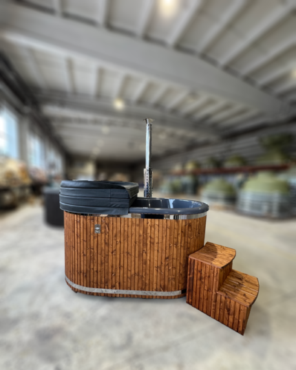 Brit Hot Tubs - CAVROS  - Fiberglass 3D Granit Hot Tub Imagine sinking into a warm, soothing embrace - the experience the CAVROS 3DG - Fiberglass 3D Granit Hot Tub promises. Designed for two, this compact, cozy hot tub offers a personal retreat where you can unwind and reconnect. At just £3,600 it's an affordable slice of luxury for your outdoor space. Key Features: Intimate Design: With a diameter of 180 cm and a water capacity of 600 litres, this hot tub is the perfect size for two. Premium Materials: The high-quality fibreglass interior is clad in Pinewood, available in soothing Grey or Brown finishes to complement your décor. Ergonomic Comfort: Sink into the comfort of the 30 cm high, 33 cm wide benches. Customizable Colors: Choose from Blue (RAL5012), White/Cream (RAL9001), or Grey (RAL7015) for the interior. Efficient Heating: An external stainless steel wood-burning oven with flue provides quick, eco-friendly heating. Protective Cover: The fibreglass lid helps retain heat and keep the water clean when not used. Why Choose the CAVROS Hot Tub? Intimate Retreat: This hot tub is perfect for couples or solo relaxation. Eco-Friendly Indulgence: The wood-burning oven reduces electricity consumption. Durable & Easy Care: The fiberglass interior is simple to clean and maintain. Stylish Personalization: Choose colours and finishes to suit your outdoor décor. Affordable Luxury: Enjoy premium features at a price that won't break the bank. Invest in your well-being and transform your outdoor space into a private sanctuary. Order the CAVROS 3DG - Fiberglass 3D Granit Hot Tub today. CAVROS 3DG - FIBREGLASS 3D Granit HOT TUB SPECIFICATIONS High-quality fibreglass insert Wood cladding walls External wood-fired heater  Internal width 100 x 167cm  External width 119 x 188cm  Capacity: 2 person Inside height 88 cm; External height 105 cm Water capacity: 600L Empty weight 120kg 0.5h – 1h heating time Insert insulated with polyurethane foam Glass heater door Stainless steel chimney 2m with a cap Chimney heat guard Hydro massage and air bubble system with 6 jets Air bubble system with 8 jets Underwater LED light 1  Exterior LED light stripe Insulated Thermo lid  2 drink holders - stainless steel Box stair Stainless steel drain valve 40mm 24 months warranty Colour of fibreglass insert available: light blue, grey, light grey or cream Stainless steel wood burning oven ( AISI 304) 30 kW or (AISI 316) 30 kW Oven front colour: Stainless steel – Grey or Black Wall cladding: Pine Wood - thickness 20 mm, Thermo Wood - thickness 20 mm, UPVC - thickness 18mm, Cedar Wood - thickness 18 mm Wood cladding stain colours: Transparent Grey, Transparent Brown, Teak, and Black Insulated Thermo lid colours: grey or brown Do you have more QUESTIONS about CAVROS fibreglass hot tub? Contact our sales team now! Here you can find alternative hot tubs.