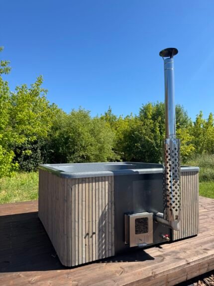 MAXOR 3DG - HOT TUB SPECIFICATIONS High-quality fibreglass insert Wood cladding walls External wood-fired heater  Internal width 200 cm  External width 220 cm  Capacity: 8-10 person Inside height 88 cm; External height 105 cm Water capacity: 1500-1600L Empty weight 340kg 2,5h – 4h heating time Insert insulated with polyurethane foam Glass heater door Stainless steel chimney 2m with a cap Chimney heat guard Hydro massage and air bubble system with 26 jets 3.3kW Air bubble system with 12 jets Underwater LED light 1 Mini LED LIGHTS 10  Exterior LED light stripe Insulated Thermo lid  2 drink holders - stainless steel Box stair Stainless steel drain valve 40mm 24 months warranty Colour of fibreglass insert available: light blue, grey, light grey or cream Stainless steel wood burning oven ( AISI 304) 30 kW or (AISI 316) 30 kW Oven front colour: Stainless steel – Grey or Black Wall cladding: Pine Wood - thickness 20 mm, Thermo Wood - thickness 20 mm, UPVC - thickness 18mm, Cedar Wood - thickness 18 mm Wood cladding stain colours: Transparent Grey, Transparent Brown, Teak, and Black Insulated Thermo lid colours: grey or brown Do you have more QUESTIONS about MAXOR fibreglass hot tub? Contact our sales team now! Here you can find alternative hot tubs.